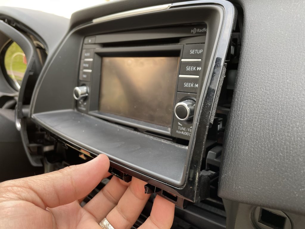 Removal of the trim piece around the radio